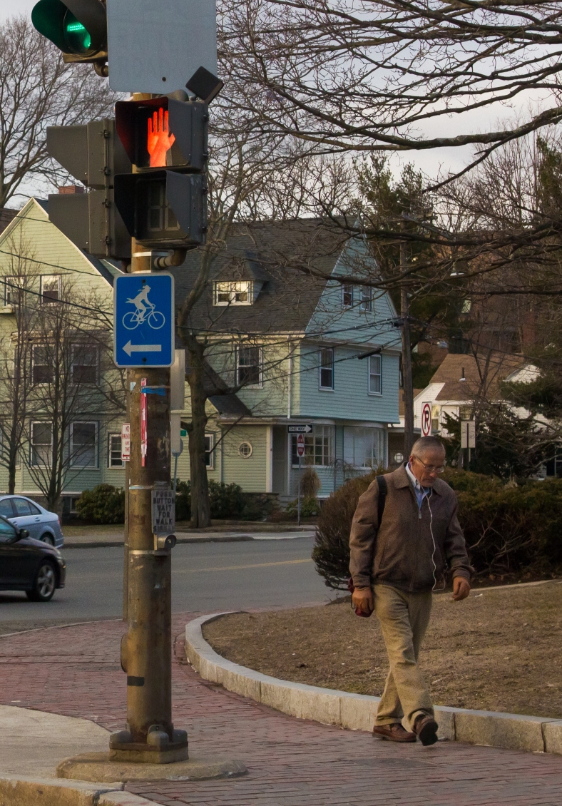 A man makes his way to the businesses or transportation on Massachusetts Avenue to start his day. March 21, 2014. SC